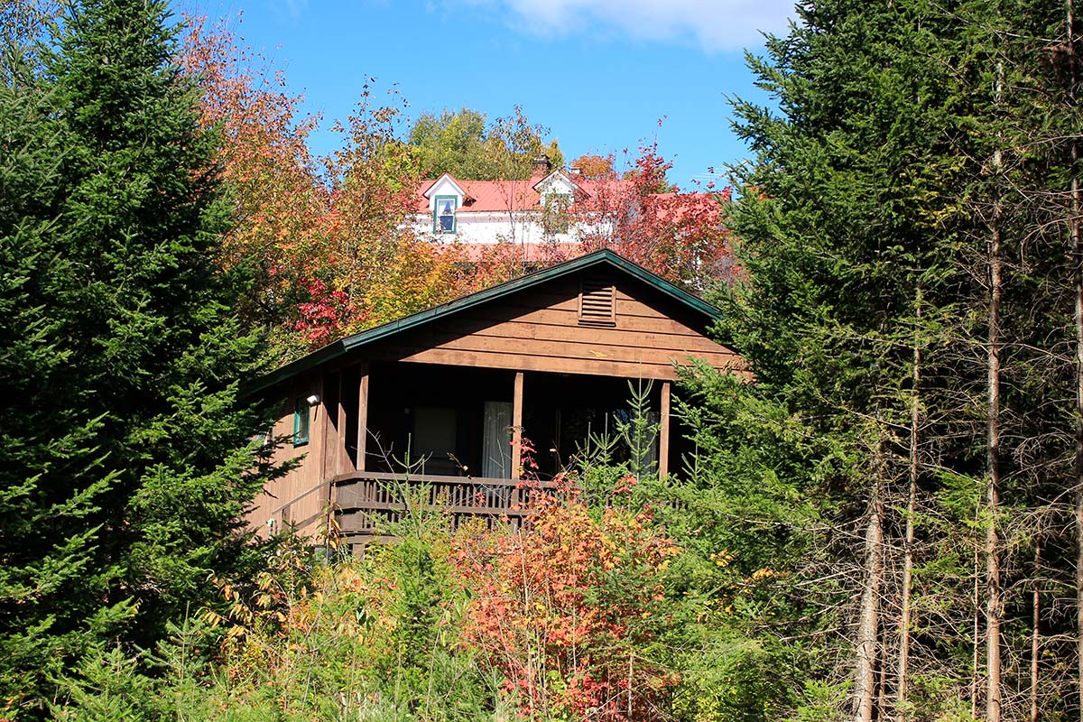 Cabin 5 exterior looking back up at the Inn