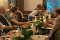 Bride and Groom kissing at the table during reception