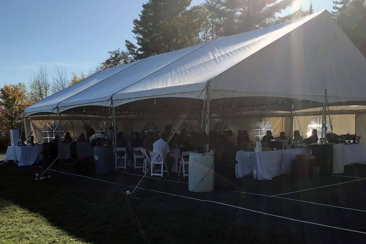Outdoor wedding under tent